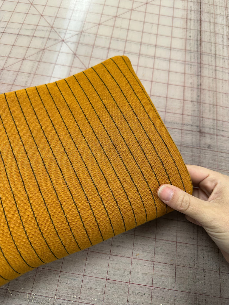 Mustard and black pencil stripe French terry knit