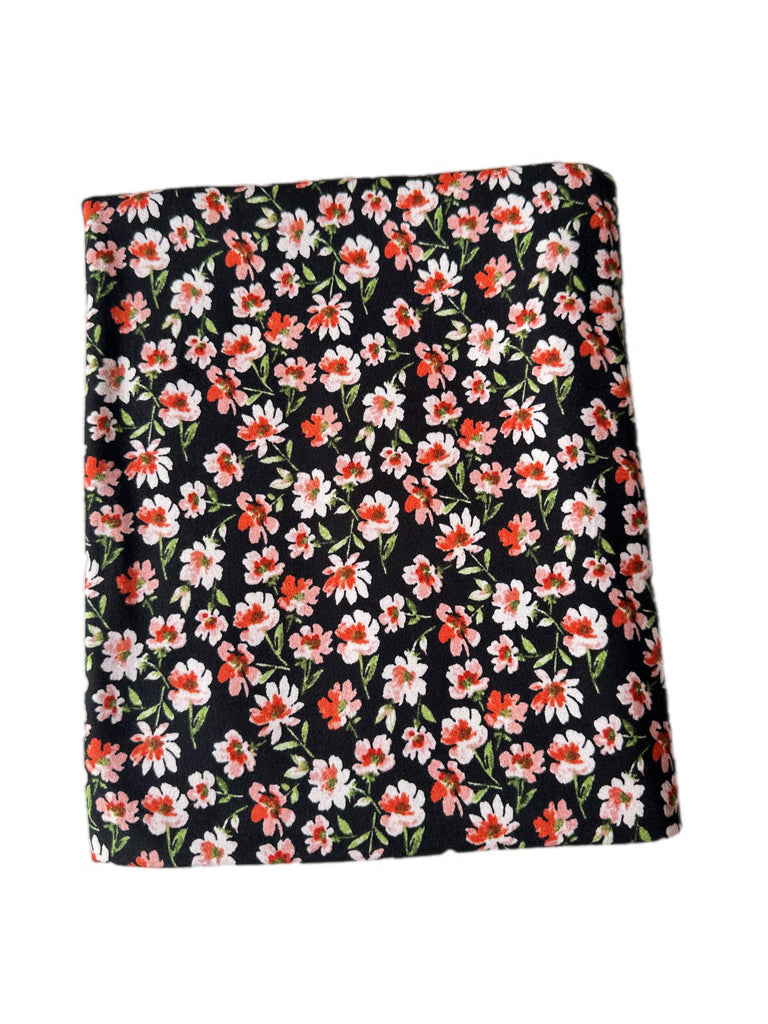 Peach and black floral brushed poly knit
