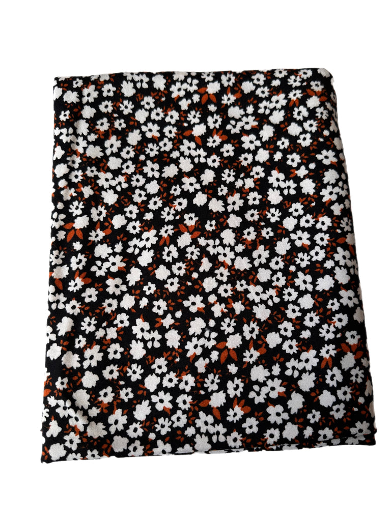 Ditsy rust black and white floral brushed poly knit